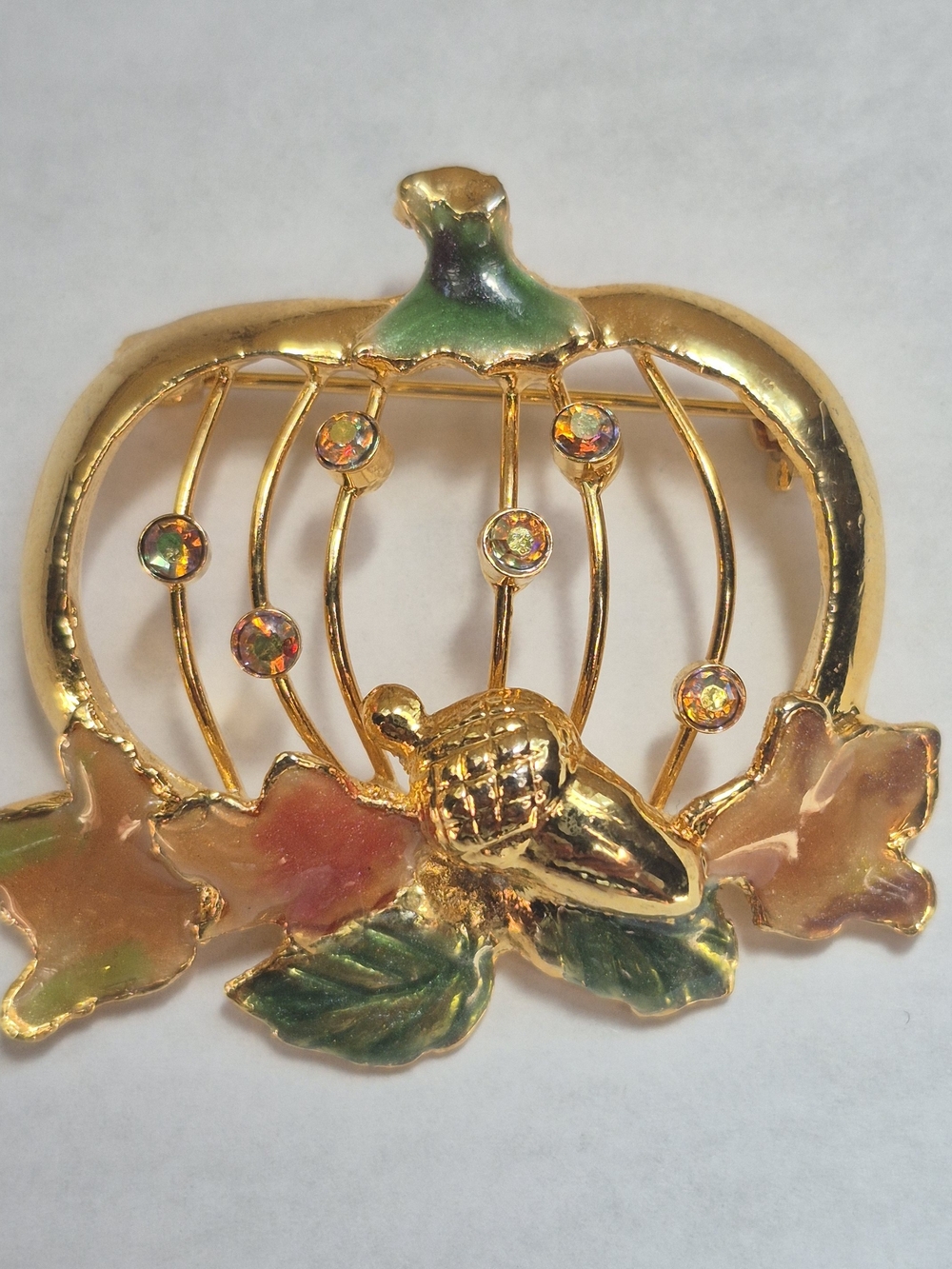 Open frame enamel pumpkin brooch